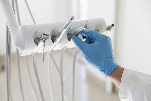 Professional Tooth Extraction technician working in Cypress Lake, FL